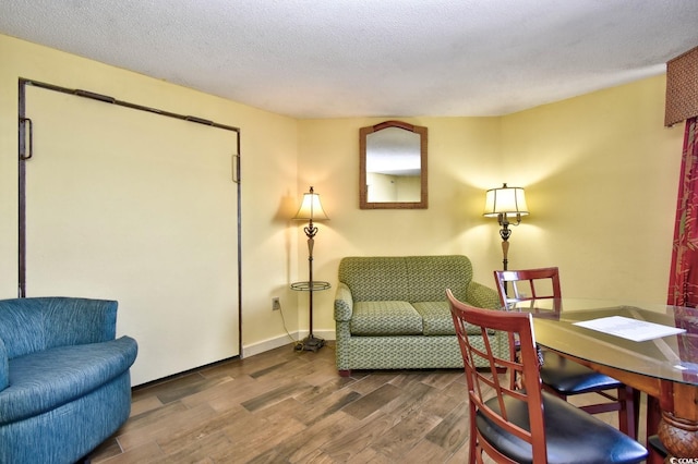 interior space with dark hardwood / wood-style flooring and a textured ceiling