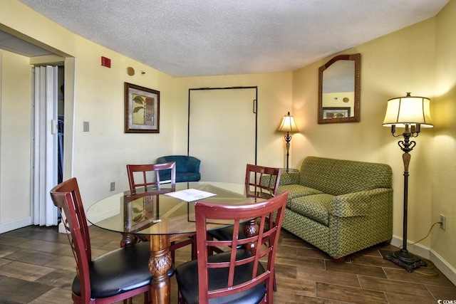 dining room featuring a textured ceiling