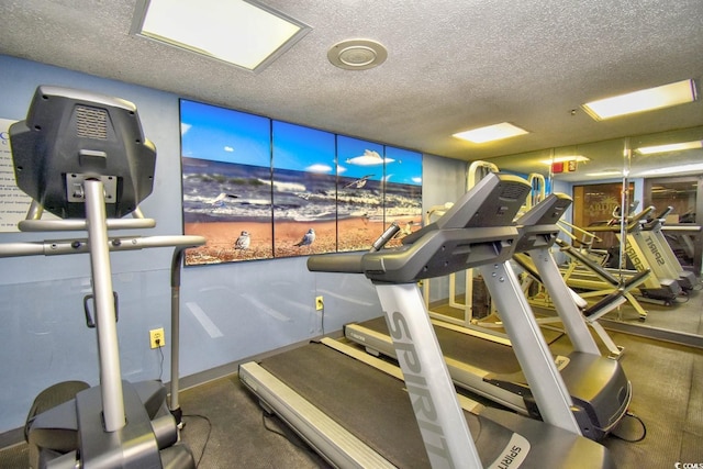 workout area featuring a textured ceiling