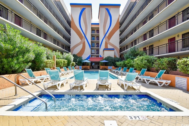 view of swimming pool with a patio