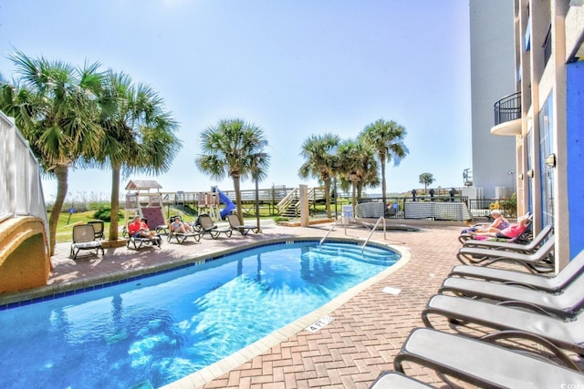 view of pool featuring a patio