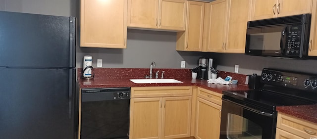 kitchen featuring light brown cabinets, black appliances, and sink