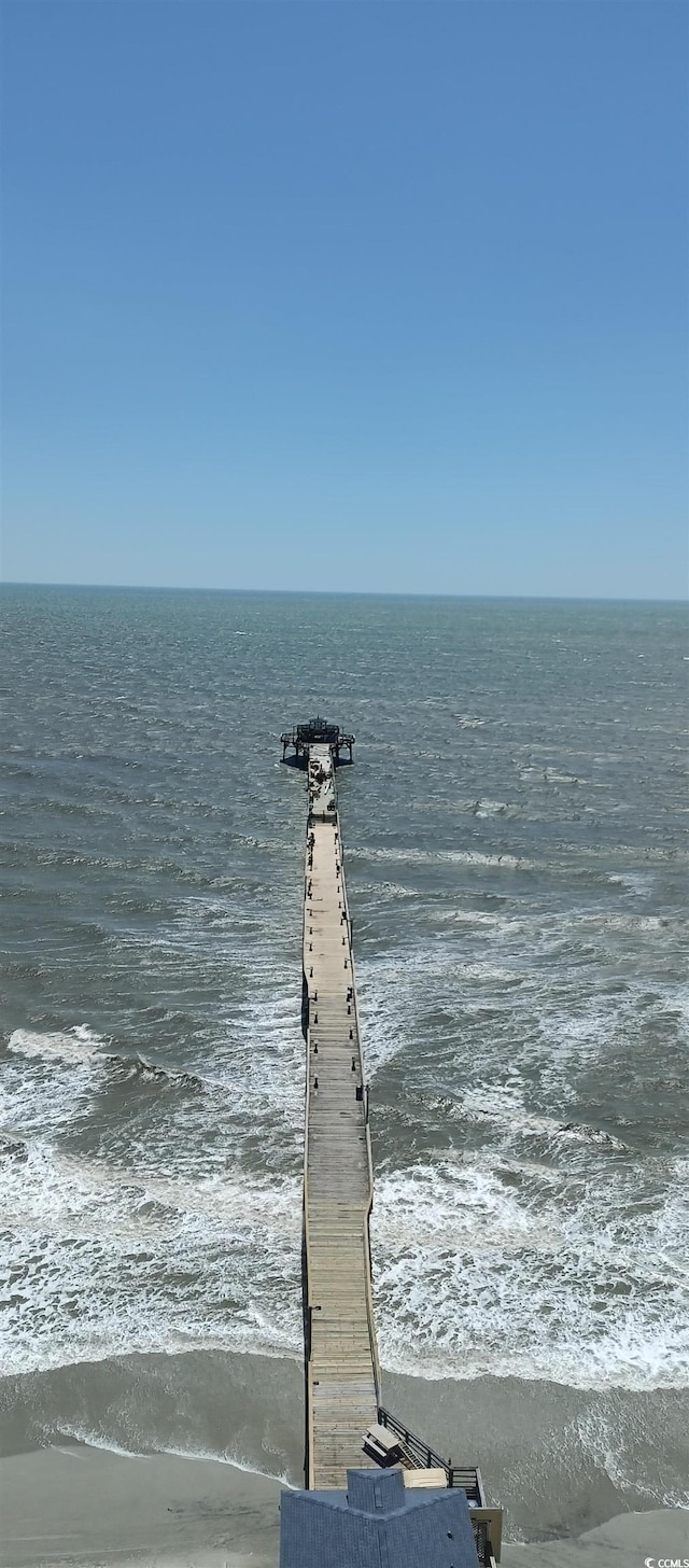 exterior space featuring a view of the beach and a water view