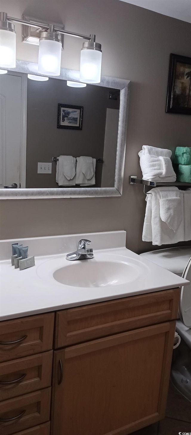 bathroom featuring vanity with extensive cabinet space