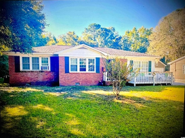 single story home featuring a wooden deck and a front lawn