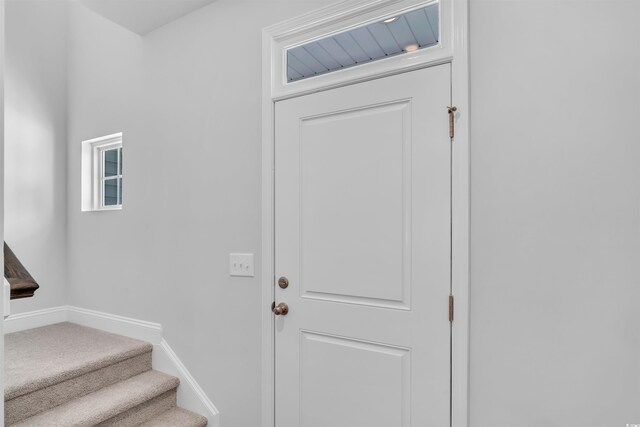 233 Sandridgebury Dr Unit 57, Little River, SC 29566 - doorway to outside featuring baseboards and stairs