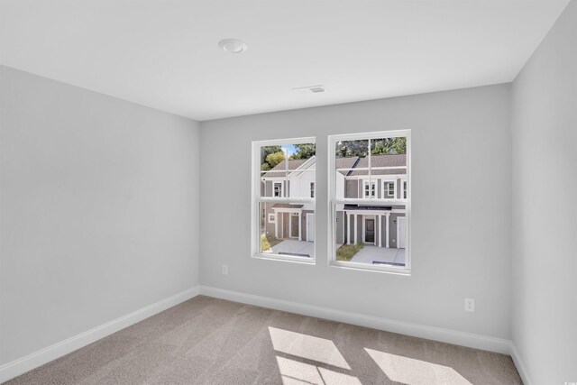 233 Sandridgebury Dr Unit 57, Little River, SC 29566 - carpeted spare room with baseboards