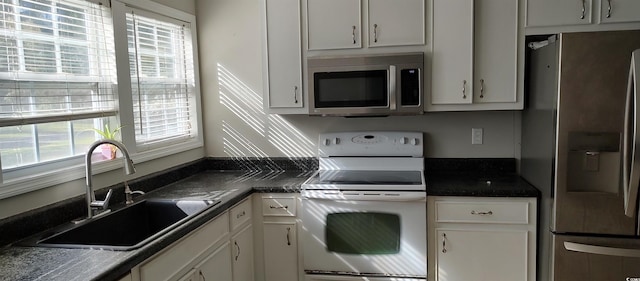 kitchen with white cabinets, sink, and stainless steel appliances