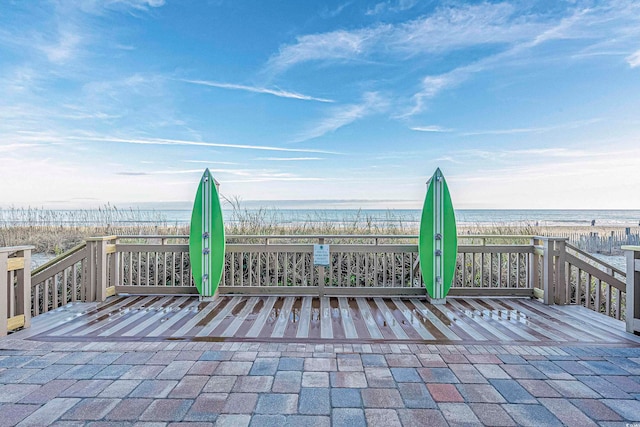 view of patio / terrace with a deck with water view