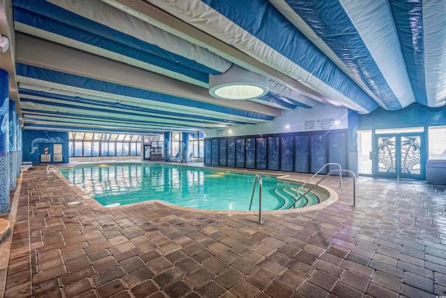 view of pool featuring a patio area and french doors