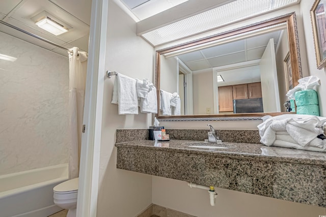 full bathroom with shower / tub combo, sink, and toilet