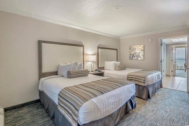 bedroom with crown molding, tile floors, and a textured ceiling