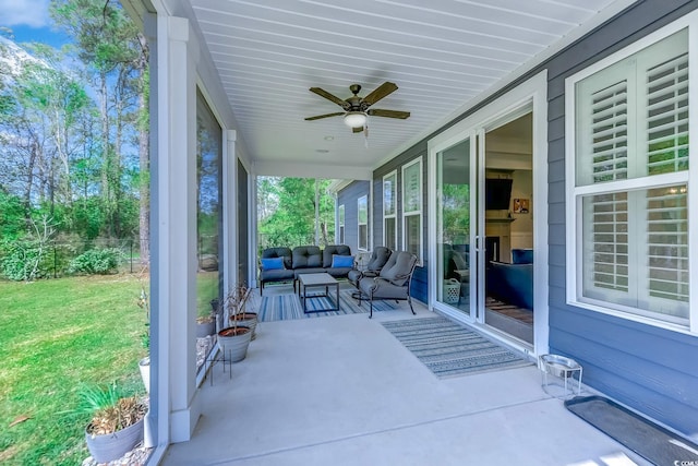 view of patio featuring ceiling fan