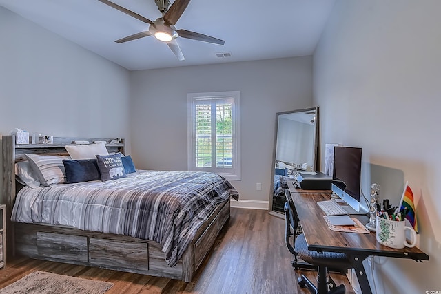 bedroom featuring ceiling fan and dark hardwood / wood-style flooring