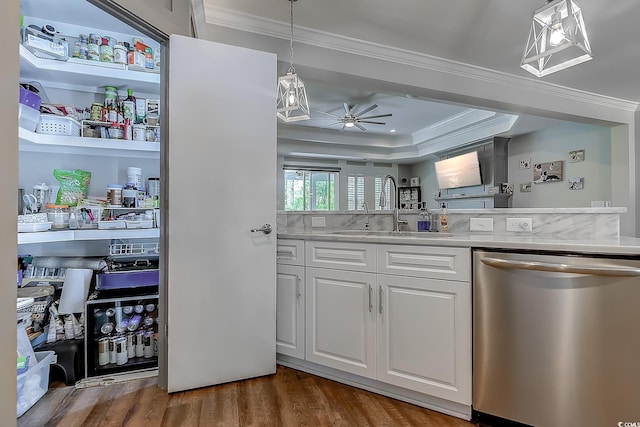 kitchen featuring white cabinetry, ceiling fan, dishwasher, pendant lighting, and sink