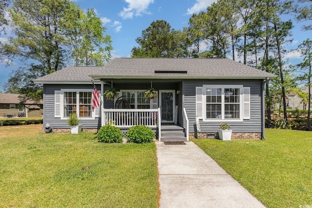 view of front facade featuring a front yard and a porch