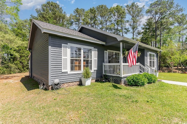 view of front of property featuring a front lawn and covered porch