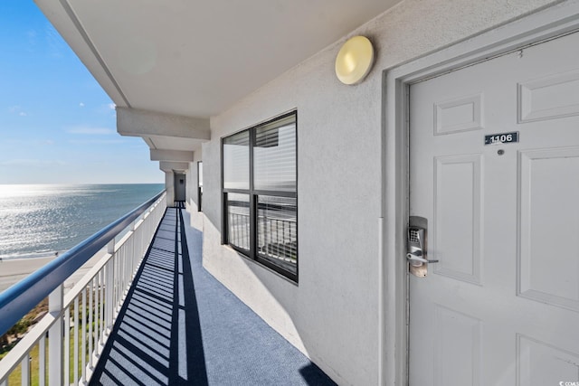 balcony featuring a water view