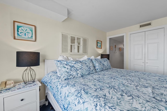 bedroom with a closet and carpet flooring