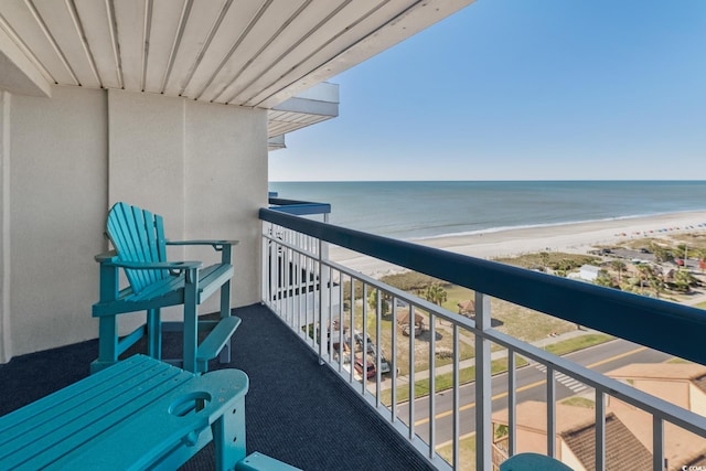 balcony featuring a beach view and a water view