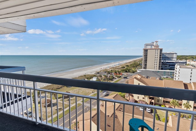 balcony featuring a beach view and a water view