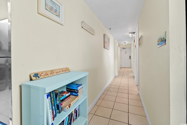 corridor with light tile flooring