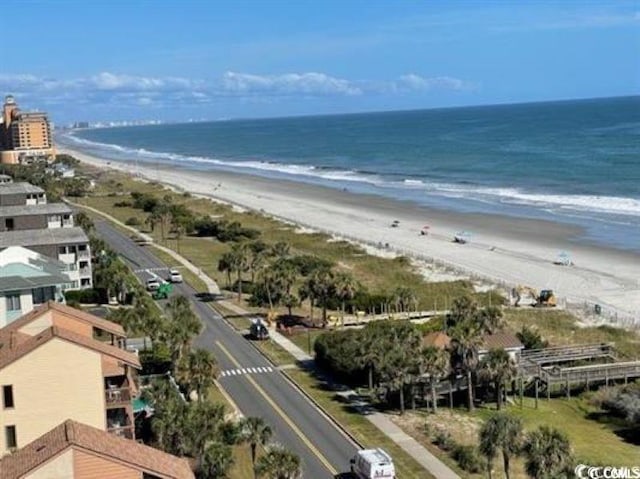 drone / aerial view with a beach view and a water view