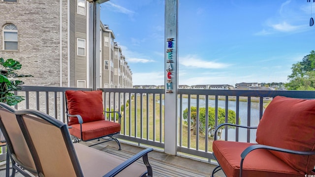 balcony featuring a water view