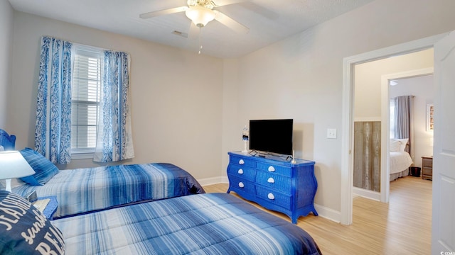 bedroom featuring ceiling fan and light wood-type flooring