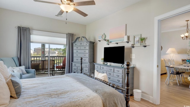 bedroom with ceiling fan with notable chandelier, light hardwood / wood-style floors, and access to exterior