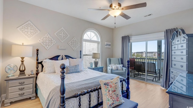 bedroom with ceiling fan, light hardwood / wood-style floors, and access to outside