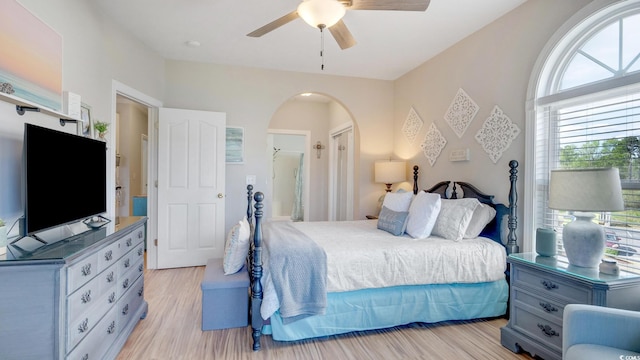 bedroom with ceiling fan and light wood-type flooring