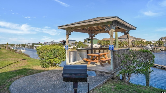 dock area with a water view and a gazebo