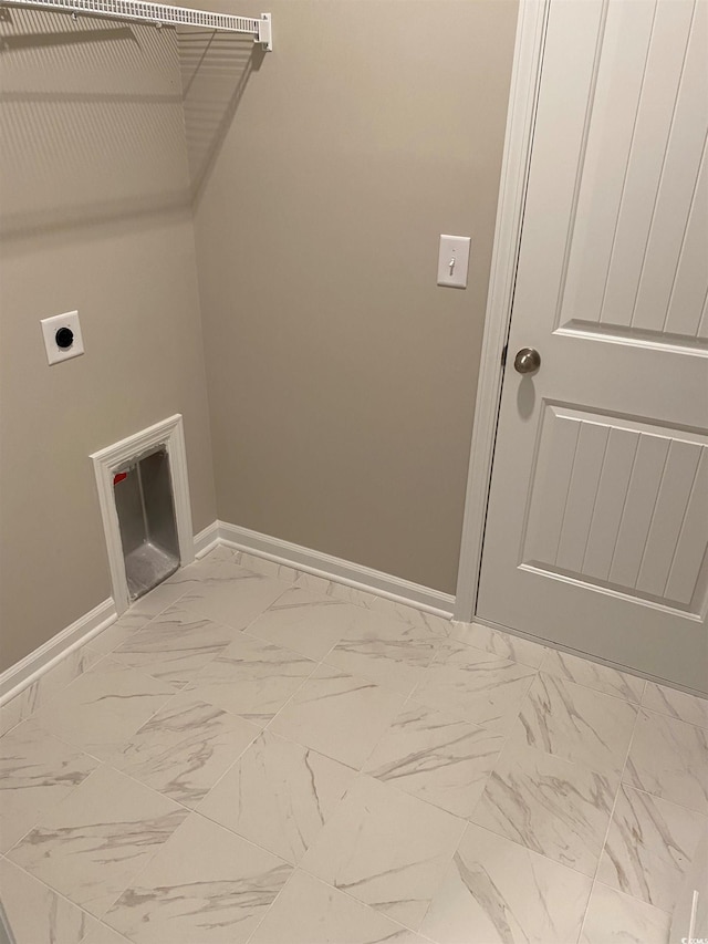 washroom with hookup for an electric dryer