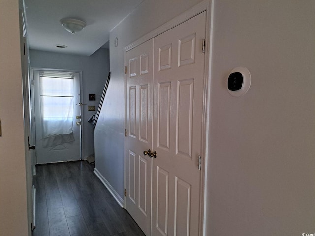 corridor featuring dark hardwood / wood-style floors