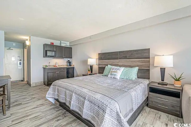 bedroom with light wood-type flooring