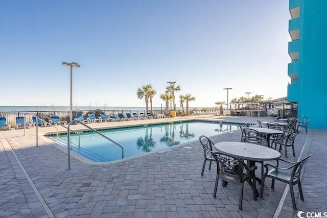 view of swimming pool featuring a patio