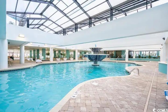 view of swimming pool featuring a patio and pool water feature