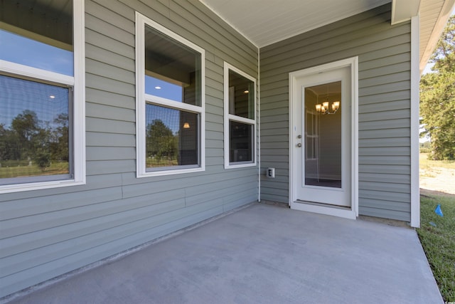 property entrance featuring a porch