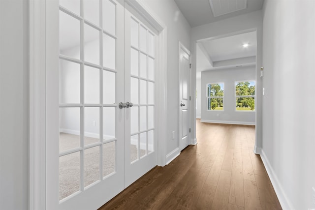 hallway with dark hardwood / wood-style floors