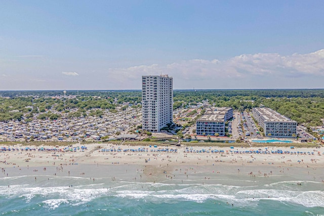 bird's eye view with a water view and a beach view