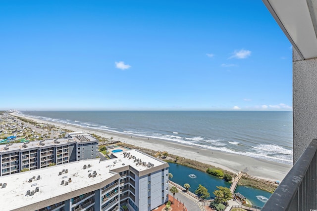 exterior space with a beach view and a water view