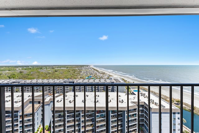 balcony featuring a water view and a view of the beach