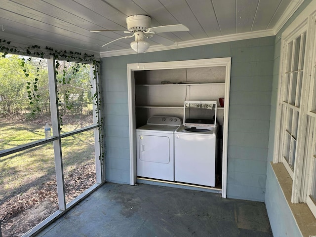 unfurnished sunroom featuring wood ceiling, ceiling fan, washer and dryer, and plenty of natural light