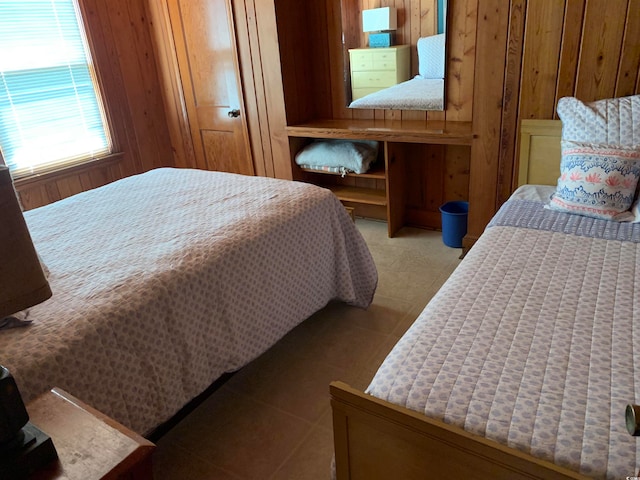 bedroom with wooden walls