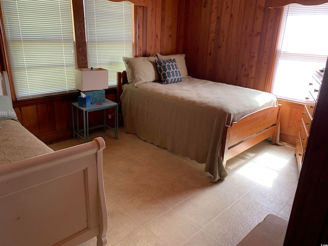 tiled bedroom with wooden walls