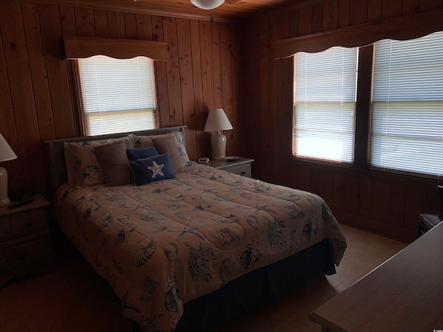 bedroom with wood walls