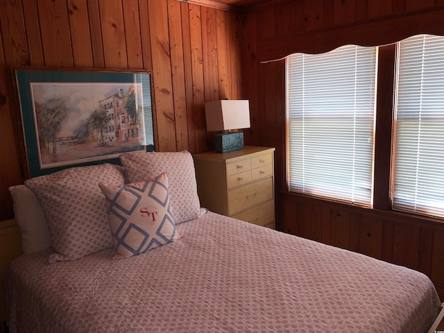 bedroom with wooden walls