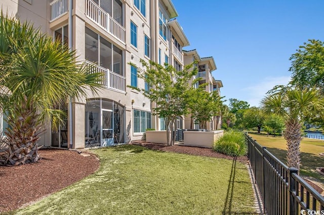 view of yard with a balcony