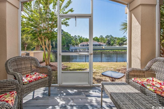 sunroom with a water view